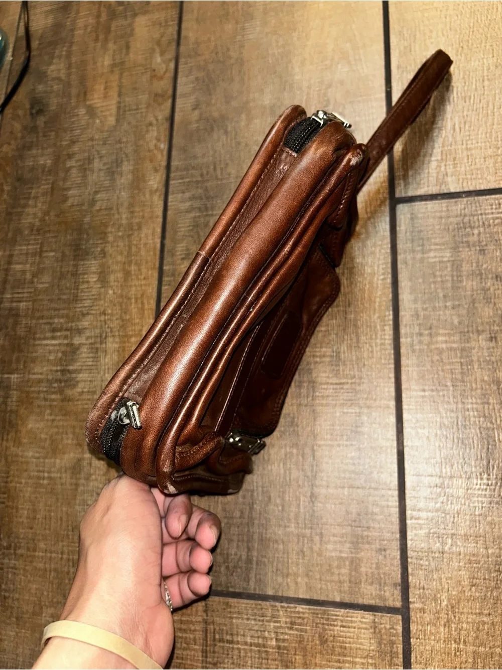 TUMI brown leather travel bag